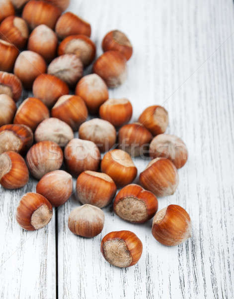 Stock photo: hazelnuts on a wooden table