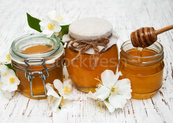 Honey with jasmine flowers Stock photo © almaje