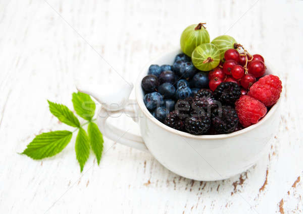 Cup  with berries  Stock photo © almaje