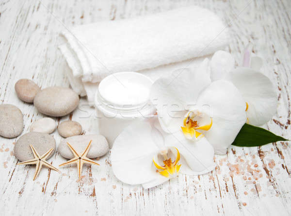spa essentials cream white towels and orchids Stock photo © almaje