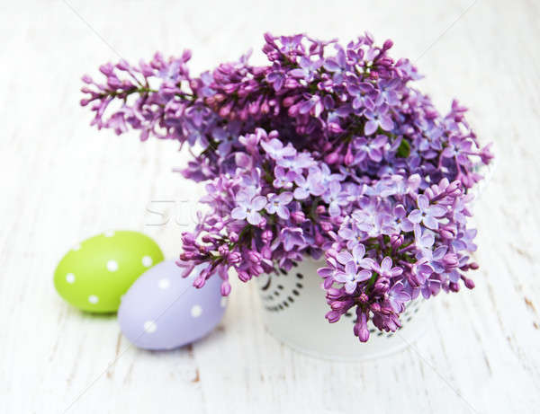 Stock photo: easter eggs and fresh lilac flowers