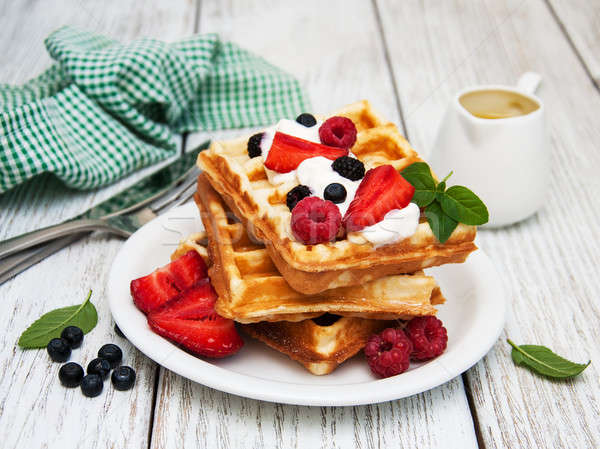 waffles with strawberries,  blueberry and sauce Stock photo © almaje