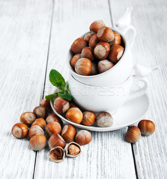 Cups with hazelnuts Stock photo © almaje