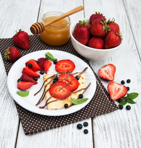crepes with strawberries and chocolate sauce Stock photo © almaje