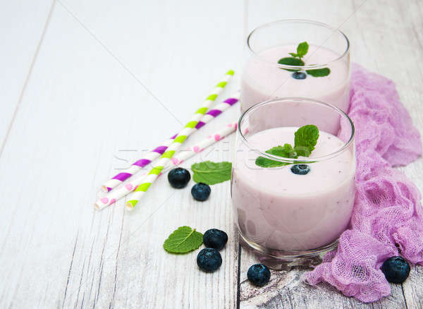 Glasses with blueberry yogurt on a table Stock photo © almaje