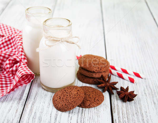 oatmeal cookies and bottles of milk Stock photo © almaje