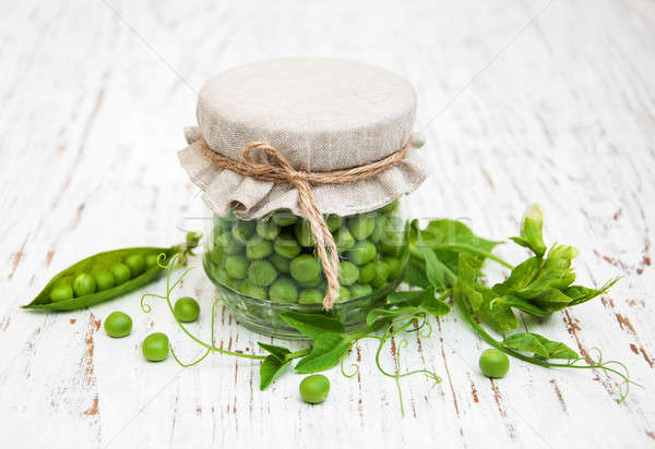 Jar with fresh peas Stock photo © almaje