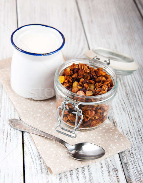 Házi készítésű granola nyitva üveg bögre tej Stock fotó © almaje