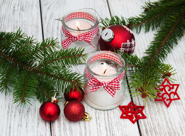  christmas decorations candles in glass jars with fir Stock photo © almaje