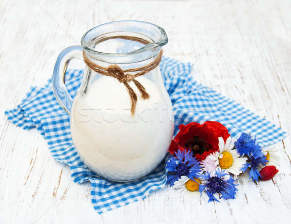 Stock photo: Jug of milk and wildflowers