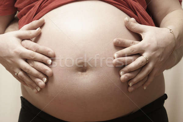 Parents Embracing Pregnant Belly Stock photo © AlphaBaby