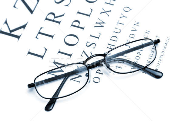 Visión corrección ojo tabla par gafas Foto stock © AlphaBaby