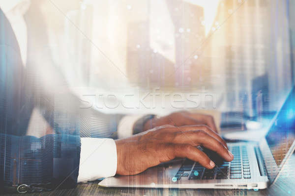 Man working on a laptop. Concept of internet sharing and interconnection Stock photo © alphaspirit