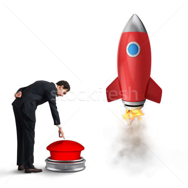 Businessman launches rocket pushing a red button. 3D Rendering Stock photo © alphaspirit