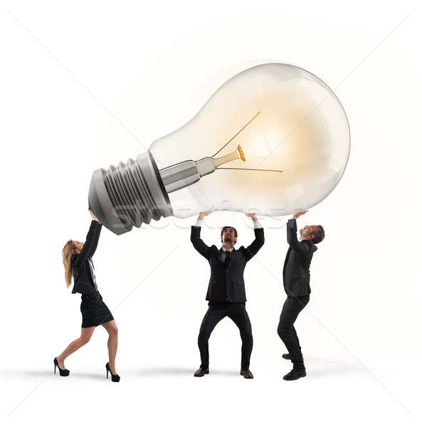 Business people hold a light bulb. concept of new idea and company startup Stock photo © alphaspirit