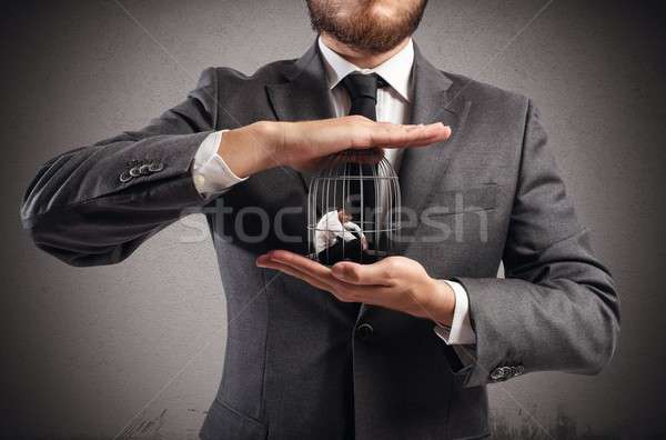 Caged  businessman Stock photo © alphaspirit