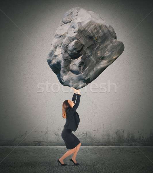 Wsparcia duży masy kobieta interesu rock Zdjęcia stock © alphaspirit