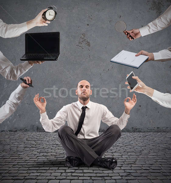 Relaxed businessman that does yoga during the work Stock photo © alphaspirit