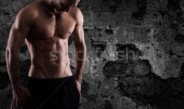 Muscular of a body building trainer man Stock photo © alphaspirit