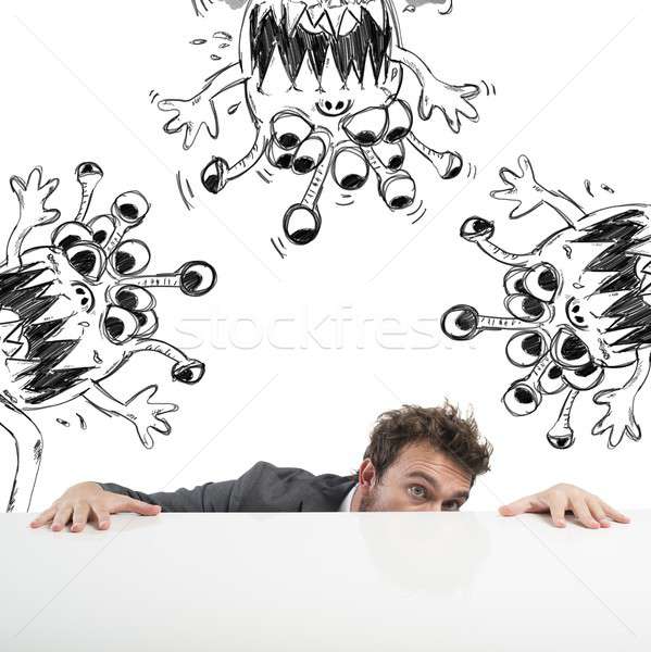 Man hides fearful of the flu virus Stock photo © alphaspirit