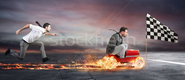 Stock photo: Fast businessman with a car wins against the competitors. Concept of success and competition