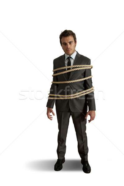 Businessman tied up with rope Stock photo © alphaspirit