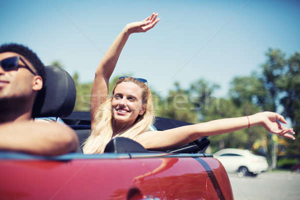 Young woman in cabriolet car departs for the summer holidays Stock photo © alphaspirit