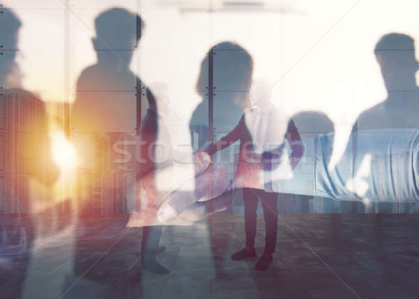 Handshaking business person in office. concept of teamwork and partnership. double exposure Stock photo © alphaspirit