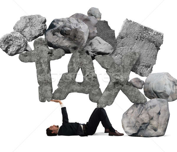 Crushed by the weight of taxes Stock photo © alphaspirit