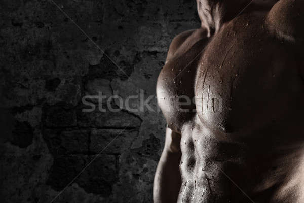 Muscular of a body building trainer man Stock photo © alphaspirit