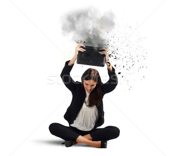 Businesswoman breaks her laptop Stock photo © alphaspirit