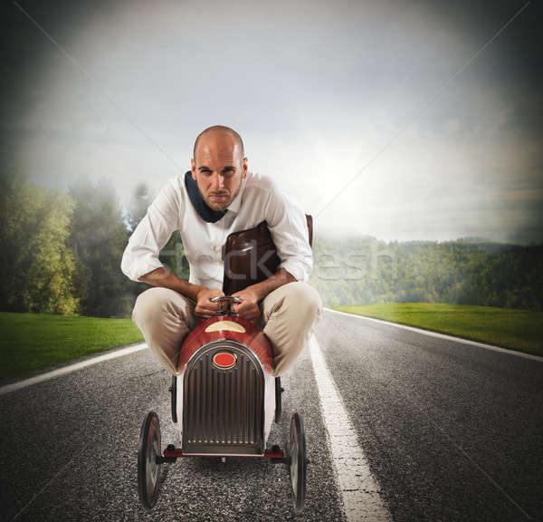 Businessman driving a fast car Stock photo © alphaspirit