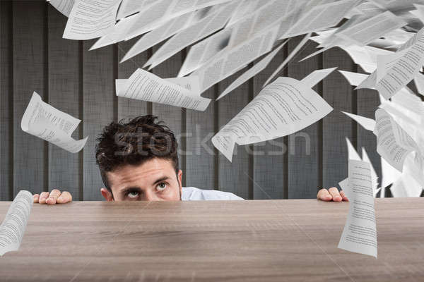 Businessman afraid under the desk. concept of overwork Stock photo © alphaspirit