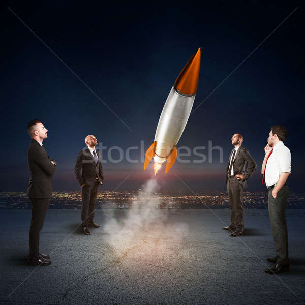 Team of businesspeople looks start a missile. Concept of company startup and new business. 3D Render Stock photo © alphaspirit