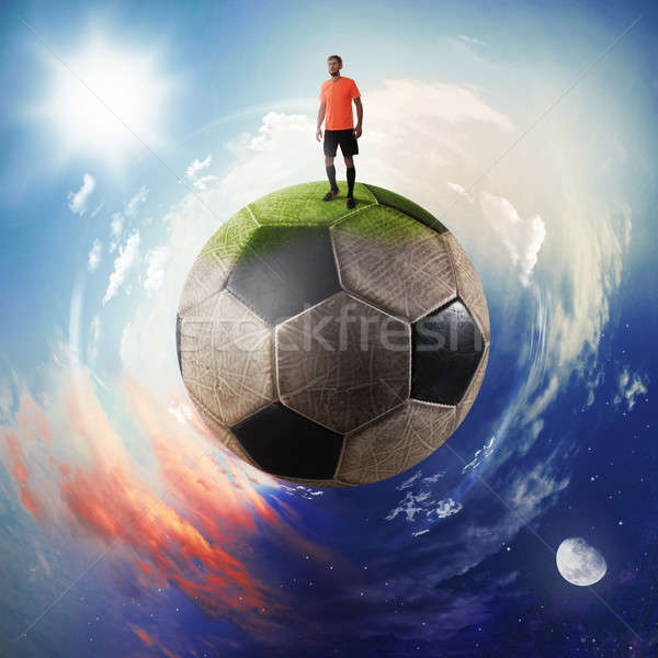Football player in a soccer ball planet Stock photo © alphaspirit