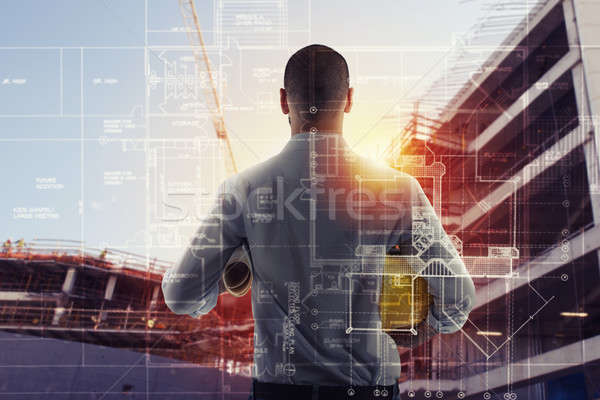 Businessman Architect analyzes the works of a building. double exposure Stock photo © alphaspirit