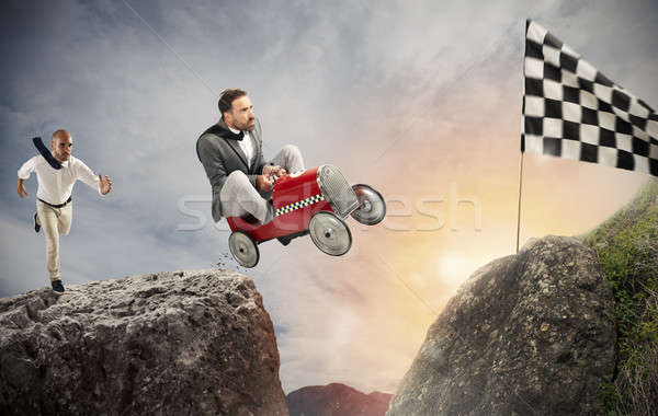 Fast businessman with a car wins against the competitors. Concept of success and competition Stock photo © alphaspirit