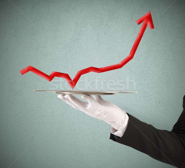 Businessman holds a tray with statistics Stock photo © alphaspirit
