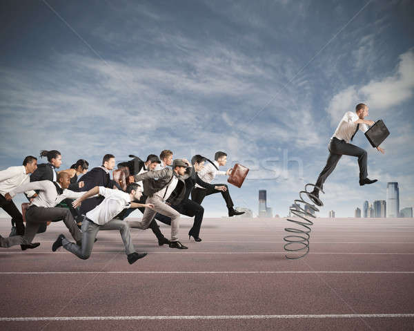 Succes om de afaceri jumping primăvară rasă afaceri Imagine de stoc © alphaspirit