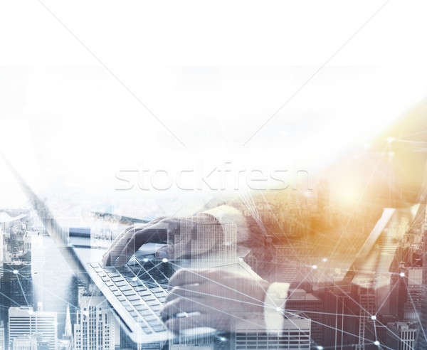 Businessperson in office connected on internet network with laptop Stock photo © alphaspirit