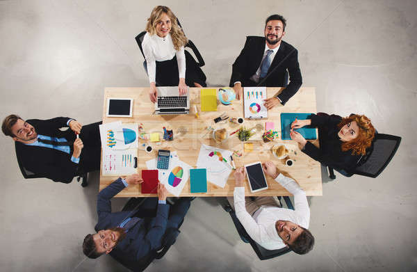 Team of businessmen work together in office. Concept of teamwork and partnership Stock photo © alphaspirit