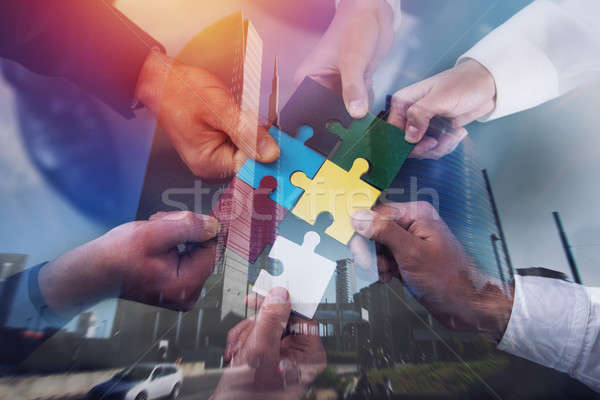 Teamwork of partners. Concept of integration and startup with puzzle pieces. double exposure Stock photo © alphaspirit