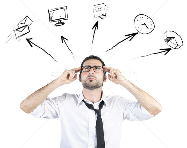 Stressed businessman tries to plan his work day Stock photo © alphaspirit
