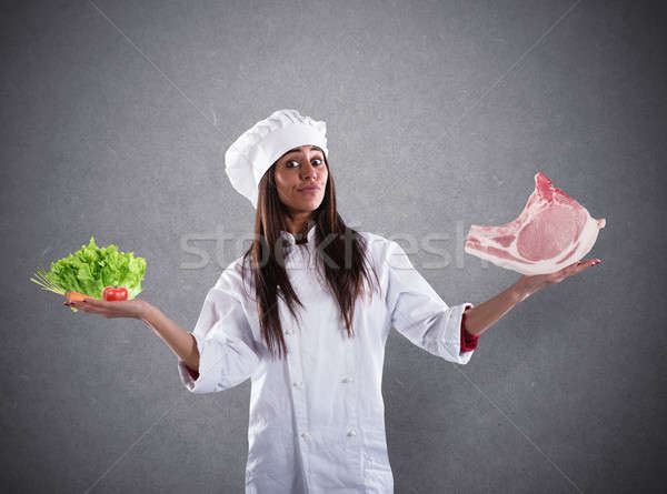 Chef undecided between fresh salad or meat steak. concept of vegetarian Stock photo © alphaspirit