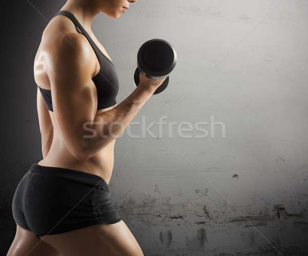 Athletic muscular woman Stock photo © alphaspirit