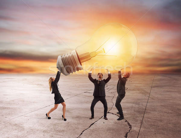 Business people hold a light bulb. concept of new idea and company startup Stock photo © alphaspirit