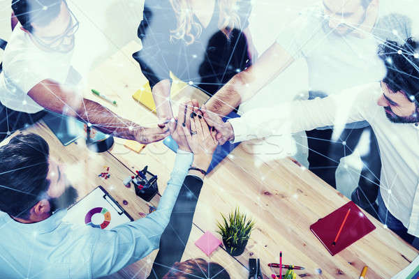 Business people putting their hands together. Concept of integration, teamwork and partnership. doub Stock photo © alphaspirit