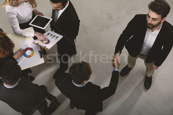 Handshaking business person in office. concept of teamwork and partnership Stock photo © alphaspirit