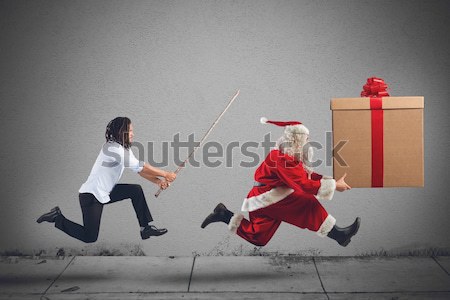 Angry child with Santa Claus Stock photo © alphaspirit