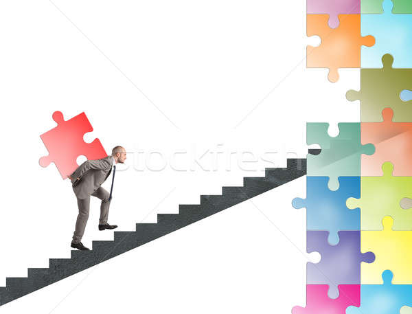 Missing piece of puzzle of a businessman build a new company Stock photo © alphaspirit